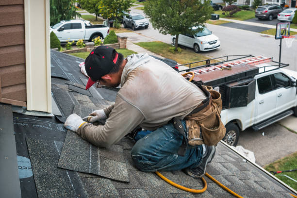 Professional Roofing technician working in Monson, MA